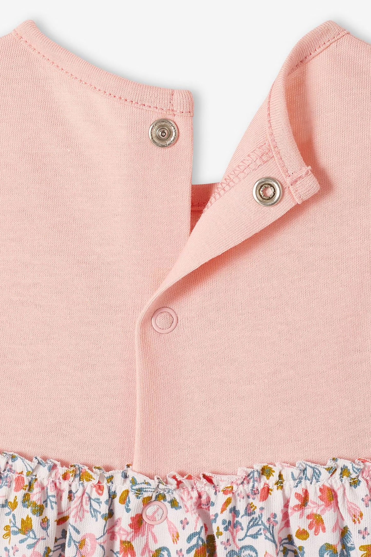 Pink sleeveless dress with floral pattern and matching headband