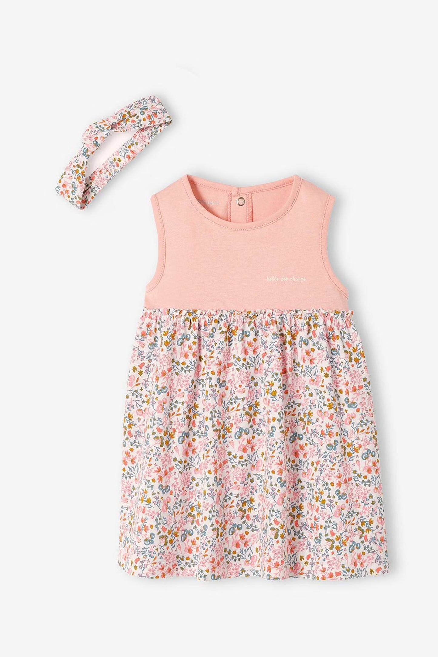 Pink sleeveless dress with floral pattern and matching headband