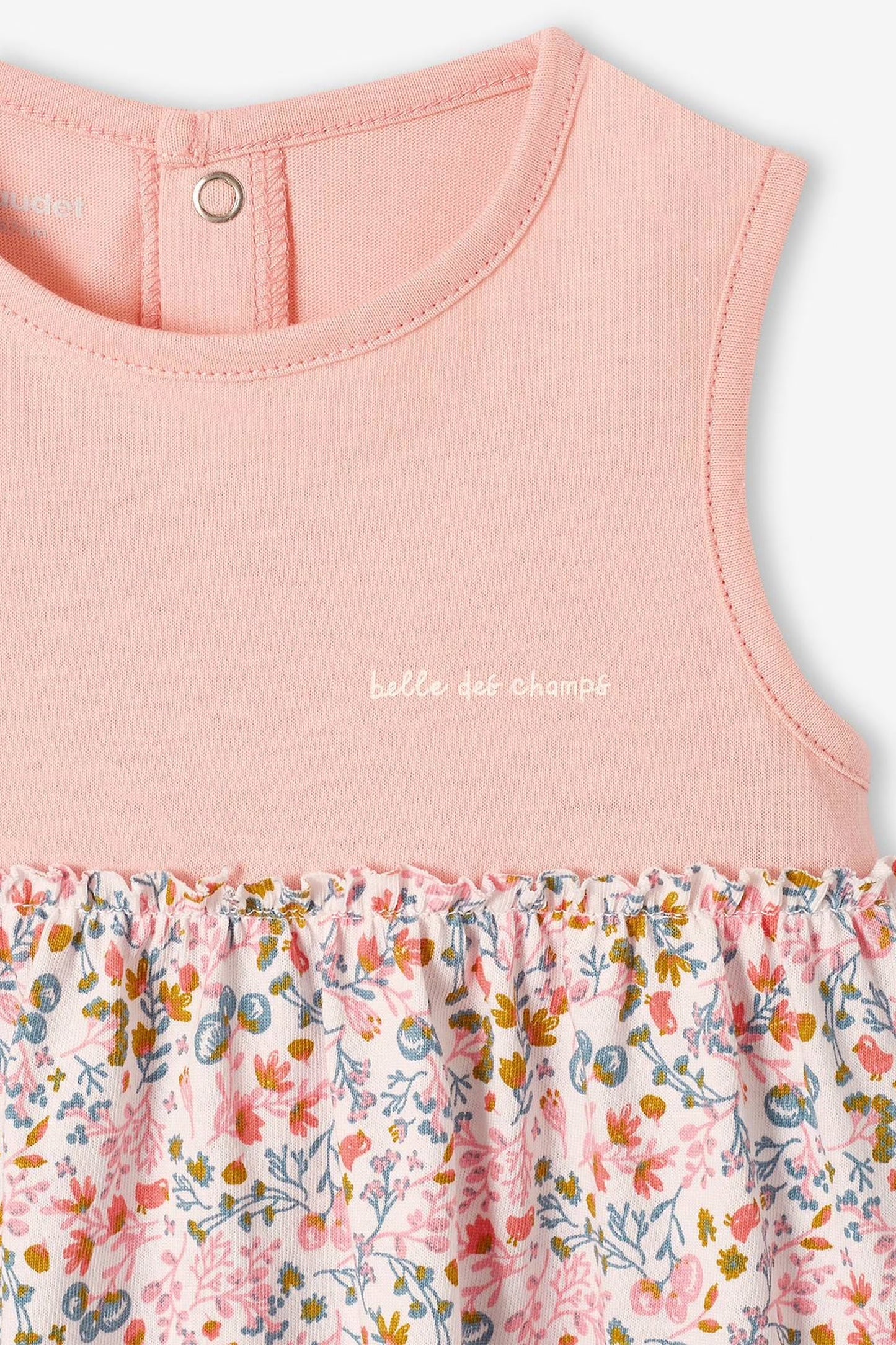 Pink sleeveless dress with floral pattern and matching headband